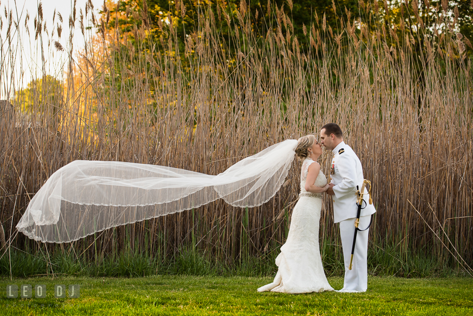 Kent Manor Inn bride with long flowing wedding gown veil almost kiss groom photo by Leo Dj Photography