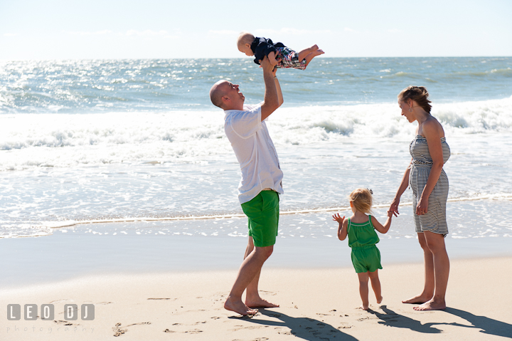 Family playing by the water on the beach. Ocean City, Maryland Eastern Shore candid children and family lifestyle photo session by photographers of Leo Dj Photography. http://leodjphoto.com