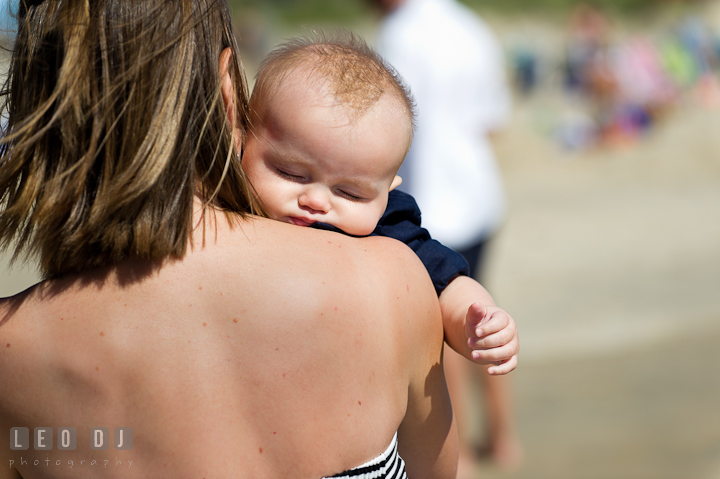 Baby boy sleeping on Mother's shoulder. Ocean City, Maryland Eastern Shore candid children and family lifestyle photo session by photographers of Leo Dj Photography. http://leodjphoto.com