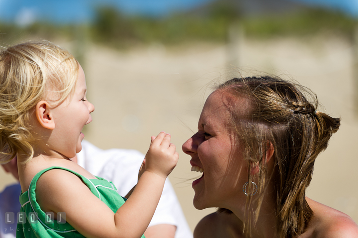 Girl laughing with Mommy. Ocean City, Maryland Eastern Shore candid children and family lifestyle photo session by photographers of Leo Dj Photography. http://leodjphoto.com