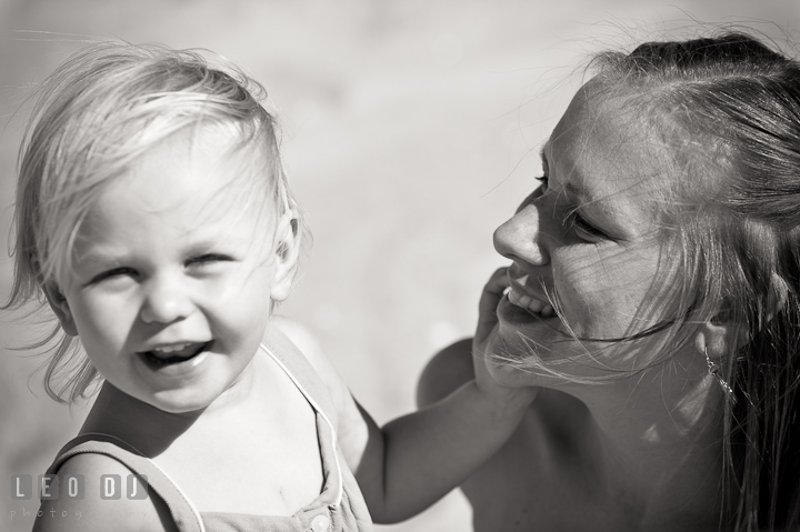 Girl smiling together with her Mother. Ocean City, Maryland Eastern Shore candid children and family lifestyle photo session by photographers of Leo Dj Photography. http://leodjphoto.com