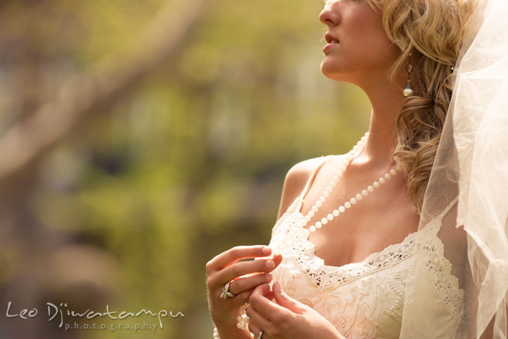 Bride playing with her necklace or jewelery. Wedding bridal portrait photo workshop with Cliff Mautner. Images by Leo Dj Photography