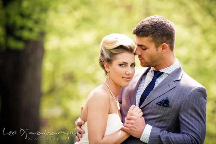 Bride and groom holding hands and cuddling. Wedding bridal portrait photo workshop with Cliff Mautner. Images by Leo Dj Photography