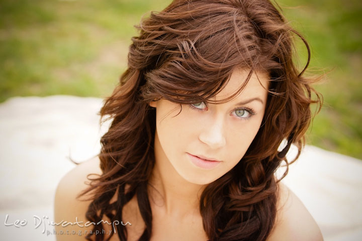 Bride sitting on the ground and looking up. Wedding bridal portrait photo workshop with Cliff Mautner. Images by Leo Dj Photography