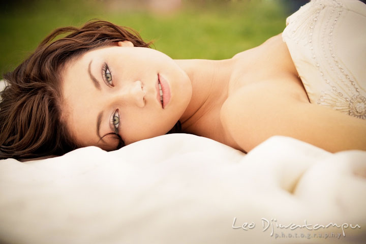 Bride laying on the ground on her dress. Wedding bridal portrait photo workshop with Cliff Mautner. Images by Leo Dj Photography