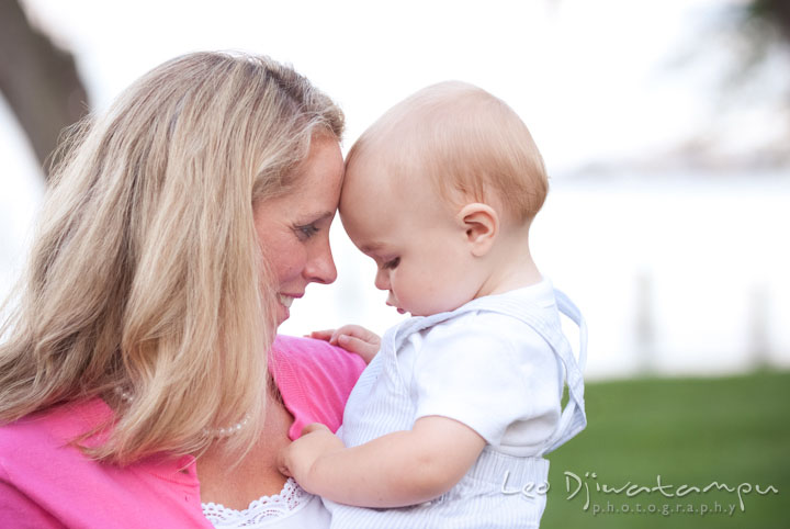 Mom hugging her baby. Edgewater, Annapolis, Eastern Shore Maryland fun and candid children and family lifestyle photo session by photographers of Leo Dj Photography.