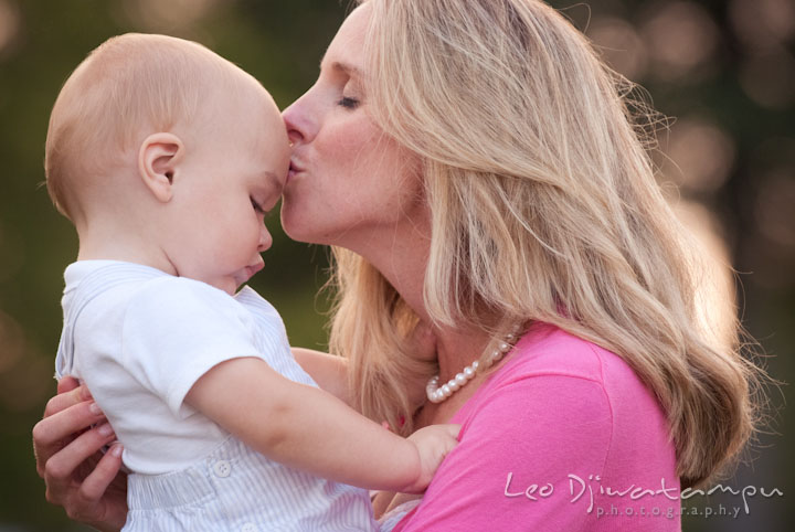 Mother kissed her toddler son. Edgewater, Annapolis, Eastern Shore Maryland fun and candid children and family lifestyle photo session by photographers of Leo Dj Photography.