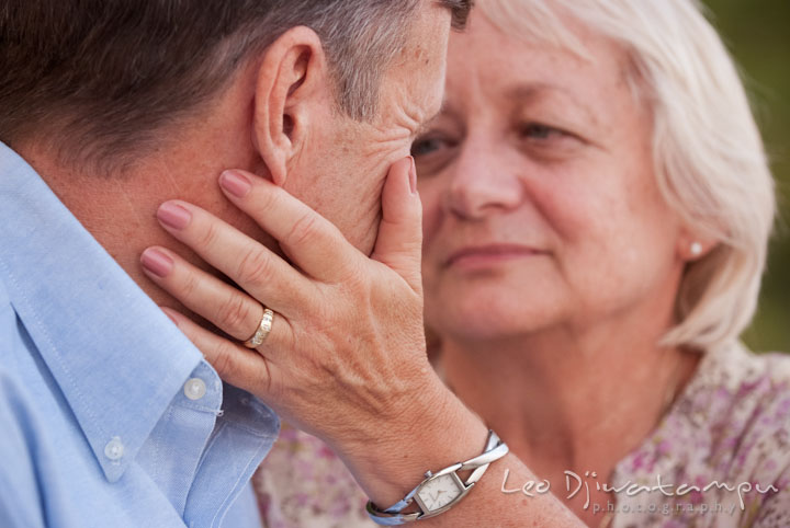 Grandmother holds grandfather and looked at him with so much love. Edgewater, Annapolis, Eastern Shore Maryland fun and candid children and family lifestyle photo session by photographers of Leo Dj Photography.