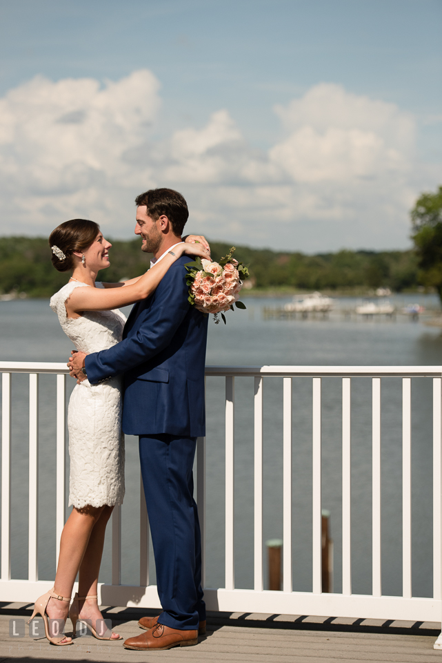 Bride and Groom hugging on the rooftop deck overlooking at the water. The Oaks Waterfront Inn wedding, St Michaels, Eastern Shore, Maryland, by wedding photographers of Leo Dj Photography. http://leodjphoto.com