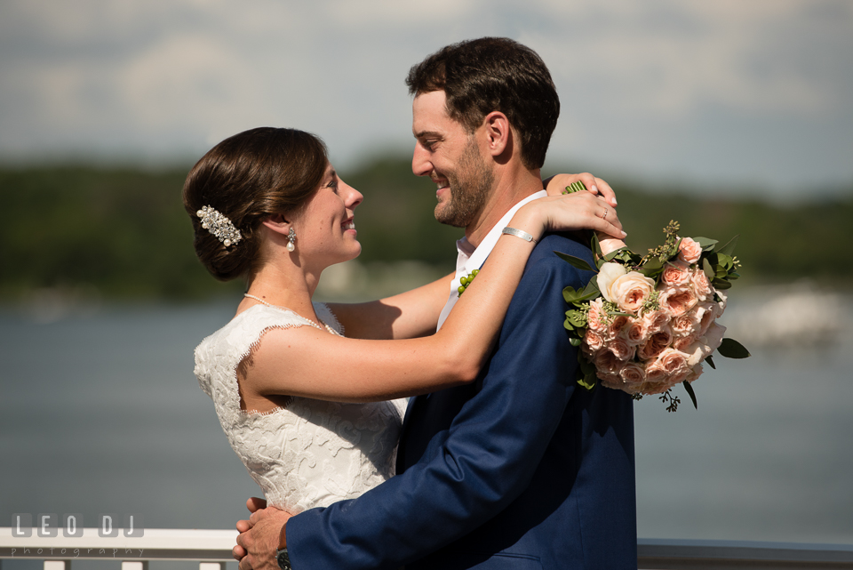 Bride and Groom embracing each other. The Oaks Waterfront Inn wedding, St Michaels, Eastern Shore, Maryland, by wedding photographers of Leo Dj Photography. http://leodjphoto.com