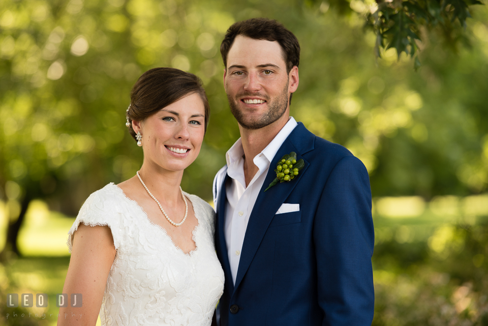 Head on shot of Bride and Groom in the garden. The Oaks Waterfront Inn wedding, St Michaels, Eastern Shore, Maryland, by wedding photographers of Leo Dj Photography. http://leodjphoto.com