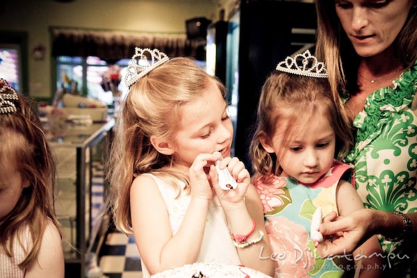 girls and mother decorating cake. Children family reunion birthday photography Tilghman Island Annapolis Kent Island Eastern Shore MD