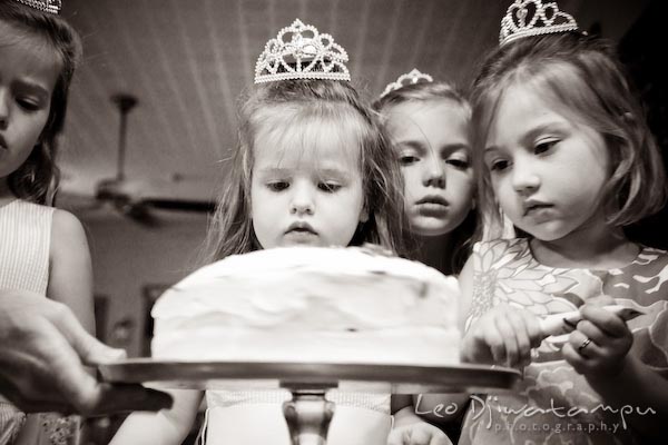 girls admiring their cake. Children family reunion birthday photography Tilghman Island Annapolis Kent Island Eastern Shore MD