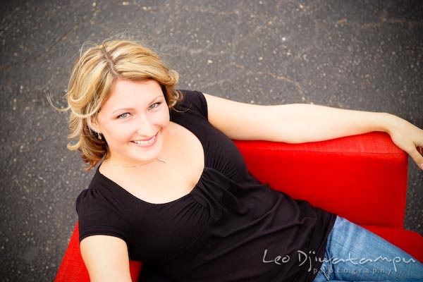 Blond girl sitting in chair, posing, looking up. Commercial work photography Annapolis Eastern Shore MD Washington DC