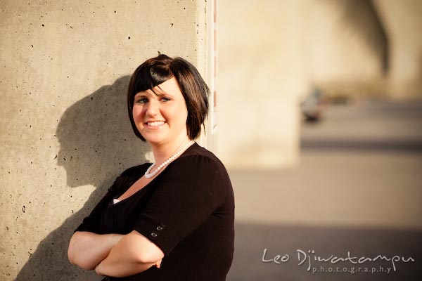 Girl smiling, posing by a wall with golden afternoon light. Commercial work photography Annapolis Eastern Shore MD Washington DC