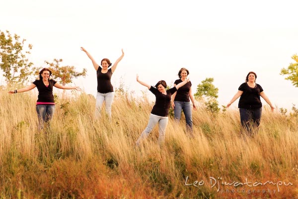 Girls, ladies raising arms posing in tall grass, meadow. Commercial work photography Annapolis Eastern Shore MD Washington DC