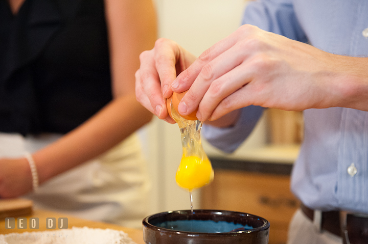 Engaged guy cracked egg. Engagement photo session at town home near Federal Hill Baltimore Maryland by wedding photographers of Leo Dj Photography (http://leodjphoto.com)