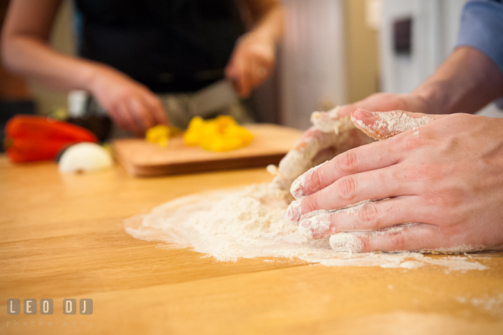 Engaged guy mixing pasta dough. Engagement photo session at town home near Federal Hill Baltimore Maryland by wedding photographers of Leo Dj Photography (http://leodjphoto.com). Engagement photo session at town home near Federal Hill Baltimore Maryland by wedding photographers of Leo Dj Photography (http://leodjphoto.com)