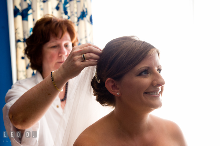 Mother of Bride helping daughter put on veil. Getting ready and ceremony wedding photos at private estate at Preston, Easton, Eastern Shore, Maryland by photographers of Leo Dj Photography. http://leodjphoto.com