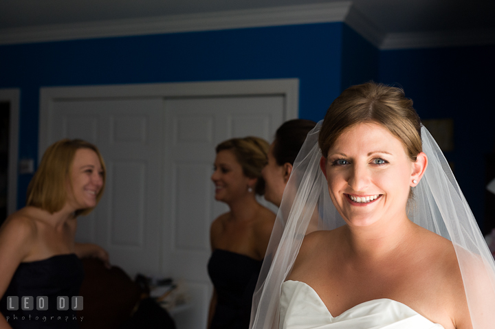 Bride smiling while Bridesmaid and Maid of Honor are talking. Getting ready and ceremony wedding photos at private estate at Preston, Easton, Eastern Shore, Maryland by photographers of Leo Dj Photography. http://leodjphoto.com