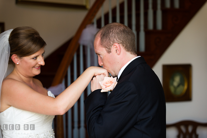 Groom kissed Bride's hand during first glance. Getting ready and ceremony wedding photos at private estate at Preston, Easton, Eastern Shore, Maryland by photographers of Leo Dj Photography. http://leodjphoto.com