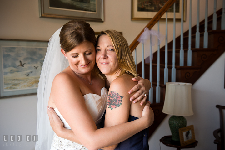 Bride hugging with Bridesmaid. Getting ready and ceremony wedding photos at private estate at Preston, Easton, Eastern Shore, Maryland by photographers of Leo Dj Photography. http://leodjphoto.com