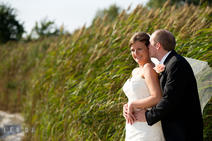 Groom kissed Bride on the cheek. Getting ready and ceremony wedding photos at private estate at Preston, Easton, Eastern Shore, Maryland by photographers of Leo Dj Photography. http://leodjphoto.com