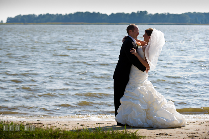 Bride and Groom hugging on the beach. Getting ready and ceremony wedding photos at private estate at Preston, Easton, Eastern Shore, Maryland by photographers of Leo Dj Photography. http://leodjphoto.com