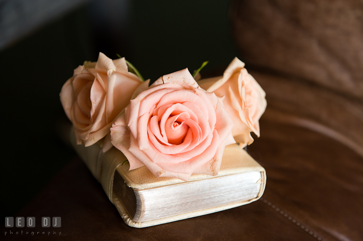 Bride's bouquet of roses on a Bible. Getting ready and ceremony wedding photos at private estate at Preston, Easton, Eastern Shore, Maryland by photographers of Leo Dj Photography. http://leodjphoto.com