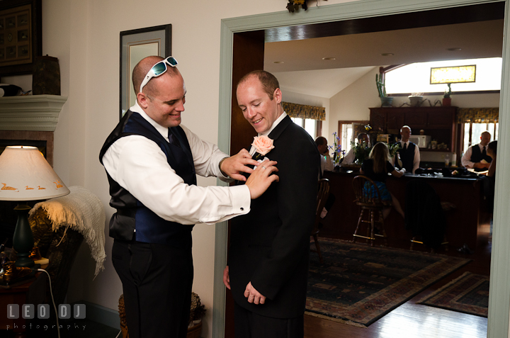 Best Man helping Groom put in handkerchief. Getting ready and ceremony wedding photos at private estate at Preston, Easton, Eastern Shore, Maryland by photographers of Leo Dj Photography. http://leodjphoto.com