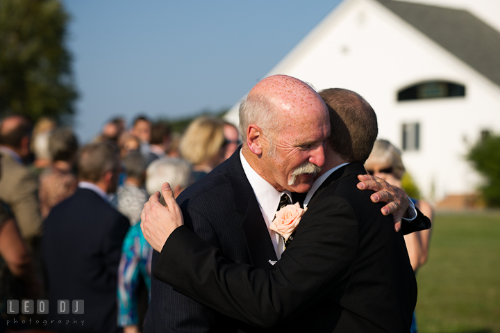 Father of the Groom hugging son. Getting ready and ceremony wedding photos at private estate at Preston, Easton, Eastern Shore, Maryland by photographers of Leo Dj Photography. http://leodjphoto.com