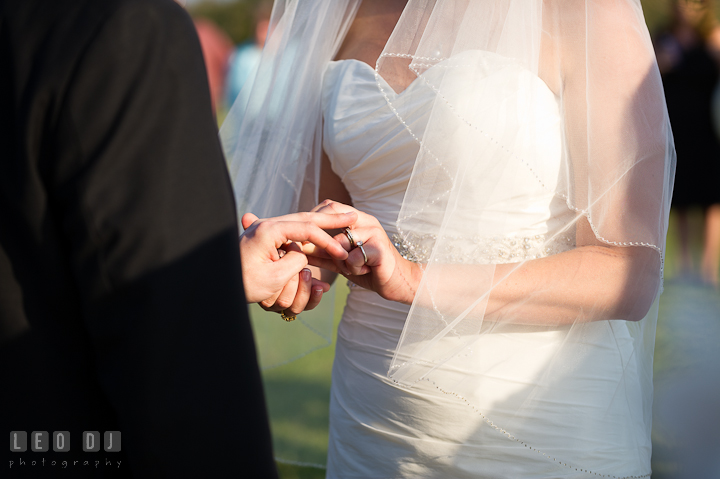 Bride and Groom exchanging wedding rings. Getting ready and ceremony wedding photos at private estate at Preston, Easton, Eastern Shore, Maryland by photographers of Leo Dj Photography. http://leodjphoto.com