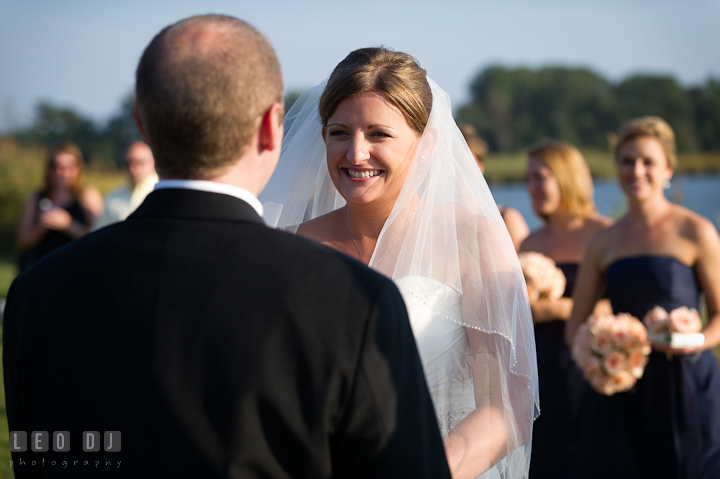 Bride smiling to Groom while reading vow. Getting ready and ceremony wedding photos at private estate at Preston, Easton, Eastern Shore, Maryland by photographers of Leo Dj Photography. http://leodjphoto.com