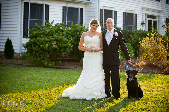 Bride and Groom posing together with their pet dog. Reception party wedding photos at private estate at Preston, Easton, Eastern Shore, Maryland by photographers of Leo Dj Photography. http://leodjphoto.com