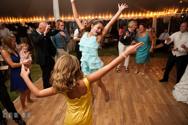 Two little girls dancing and jumping. Reception party wedding photos at private estate at Preston, Easton, Eastern Shore, Maryland by photographers of Leo Dj Photography. http://leodjphoto.com