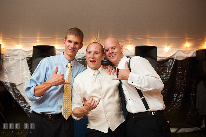 Groom and guests doing the metal hand gesture. Reception party wedding photos at private estate at Preston, Easton, Eastern Shore, Maryland by photographers of Leo Dj Photography. http://leodjphoto.com