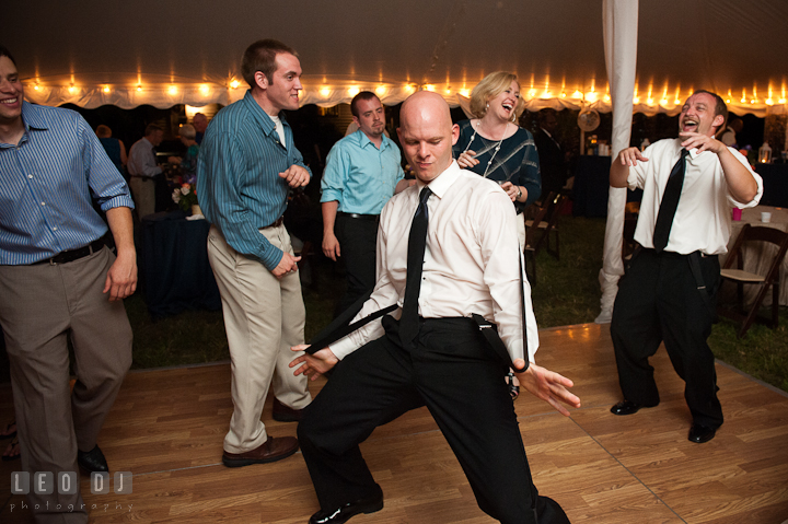 Groomsmen doing silly dance while other guests laughing. Reception party wedding photos at private estate at Preston, Easton, Eastern Shore, Maryland by photographers of Leo Dj Photography. http://leodjphoto.com