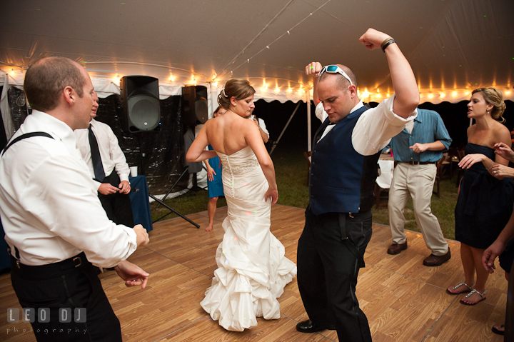 Best Man doing silly dance with Bride and Groom. Reception party wedding photos at private estate at Preston, Easton, Eastern Shore, Maryland by photographers of Leo Dj Photography. http://leodjphoto.com