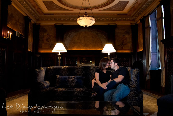 Engaged couple lounging in a sofa. Tremont Plaza Hotel and Grand Historic Venue Baltimore Pre-wedding Engagement Photo Session by wedding photographers Leo Dj Photography