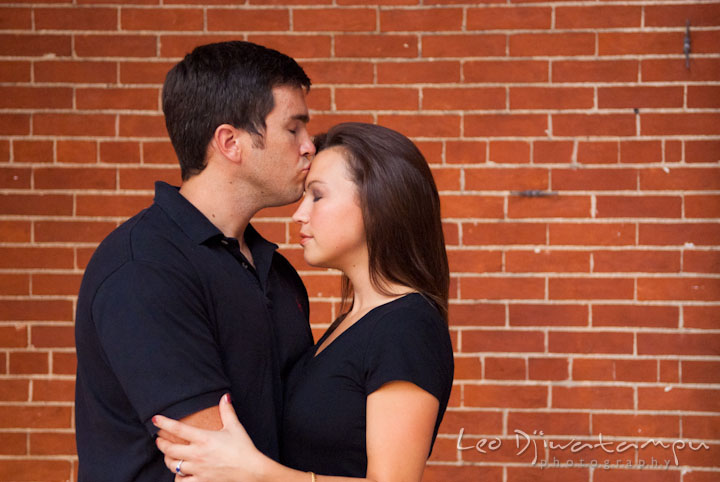 Engaged guy kissed his fiancée on the forehead. Tremont Plaza Hotel and Grand Historic Venue Baltimore Pre-wedding Engagement Photo Session by wedding photographers Leo Dj Photography