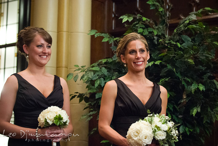 Maid of honor and bridesmaid smiling during ceremony. Baltimore Maryland Tremont Plaza Hotel Grand Historic Venue wedding ceremony and reception photos, by photographers of Leo Dj Photography.