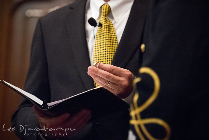 Officiant holding wedding bands. Baltimore Maryland Tremont Plaza Hotel Grand Historic Venue wedding ceremony and reception photos, by photographers of Leo Dj Photography.