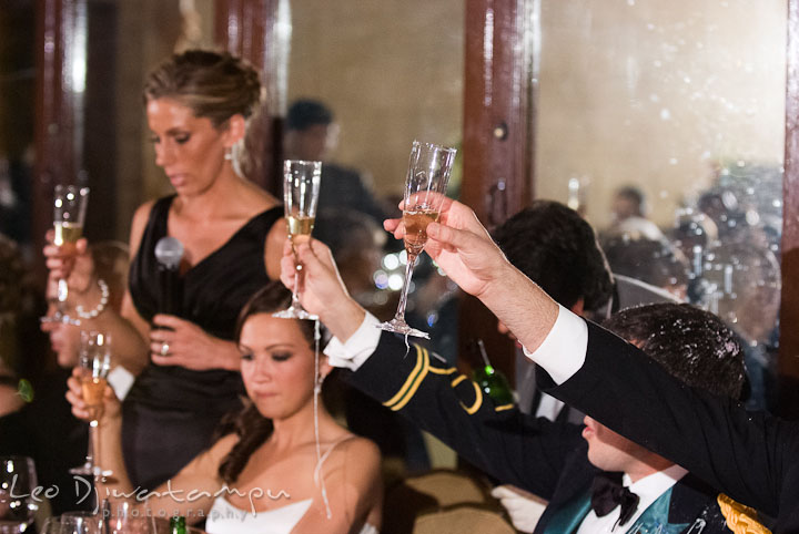 Bride groom and guests raised champagne glass. Baltimore Maryland Tremont Plaza Hotel Grand Historic Venue wedding ceremony and reception photos, by photographers of Leo Dj Photography.