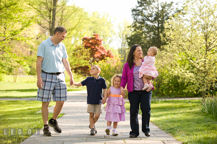 Family walking together holding hands. Washington DC, Silver Spring, Maryland candid children and family lifestyle photo session by photographers of Leo Dj Photography.