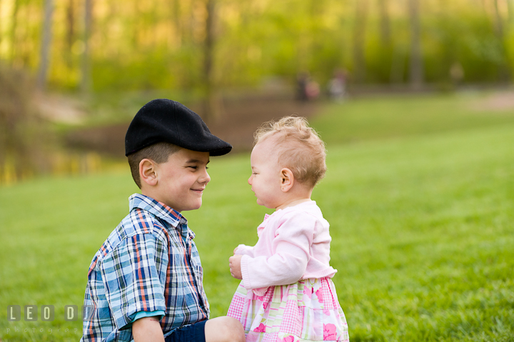 Boy and his baby sister smiled at each other. Washington DC, Silver Spring, Maryland candid children and family lifestyle photo session by photographers of Leo Dj Photography.