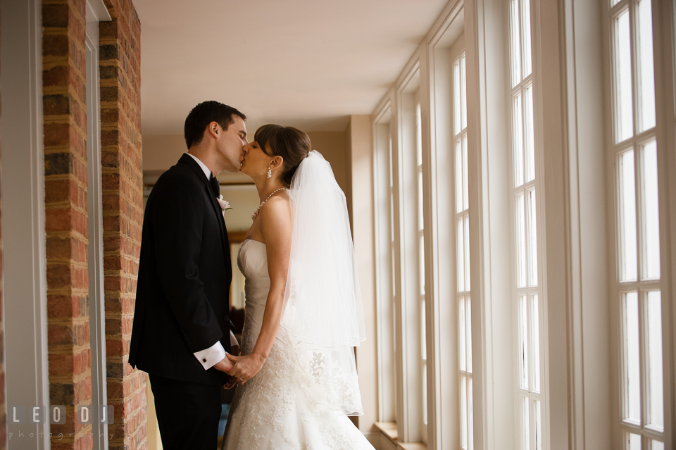 Bride and Groom kissing during their first glance. Aspen Wye River Conference Centers wedding at Queenstown Maryland, by wedding photographers of Leo Dj Photography. http://leodjphoto.com