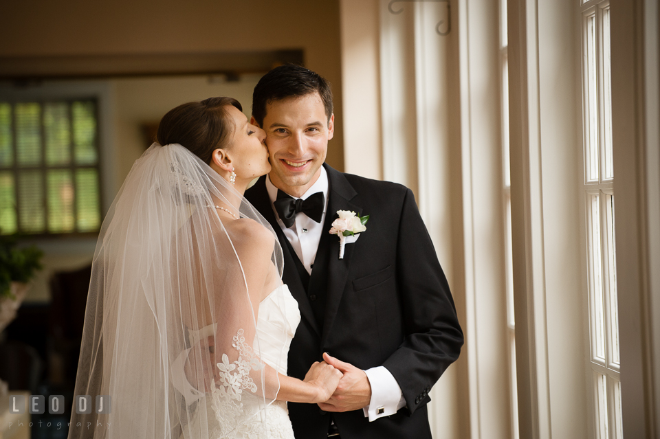 Bride kisses Groom. Aspen Wye River Conference Centers wedding at Queenstown Maryland, by wedding photographers of Leo Dj Photography. http://leodjphoto.com