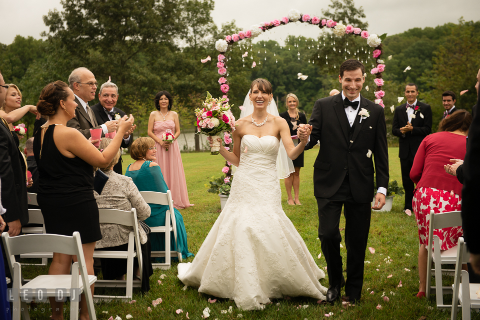 Guests toss rose flower petals to Bride and Groom during the recessional. Aspen Wye River Conference Centers wedding at Queenstown Maryland, by wedding photographers of Leo Dj Photography. http://leodjphoto.com
