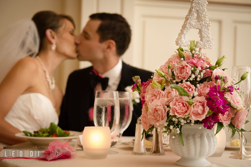 Lovely table centerpiece at sweetheart table by florist Seasonal Flowers. Aspen Wye River Conference Centers wedding at Queenstown Maryland, by wedding photographers of Leo Dj Photography. http://leodjphoto.com