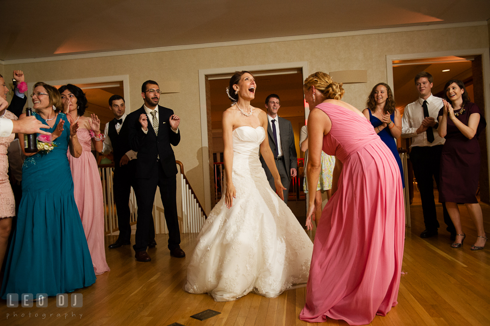 Bride having fun dancing with bridesmaid and guests. Aspen Wye River Conference Centers wedding at Queenstown Maryland, by wedding photographers of Leo Dj Photography. http://leodjphoto.com
